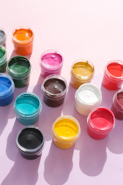 Multicolored gouache bright and new gouache The jars are laid out on a bright and even background