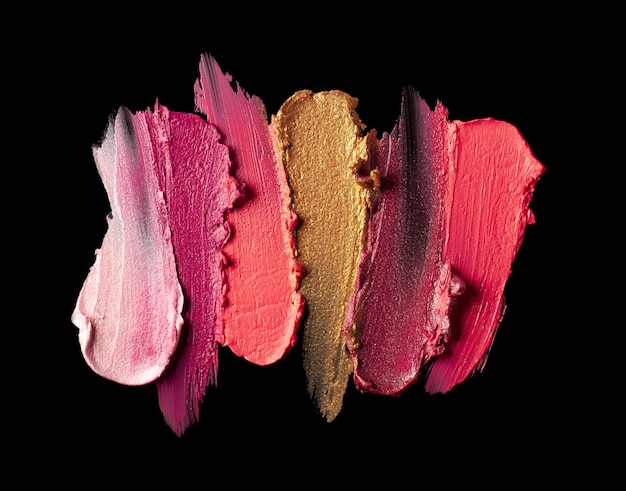 Multicolored lipstick sample smudge black isolated background