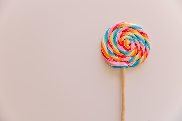 Multicolored lollipop closeup on a white background