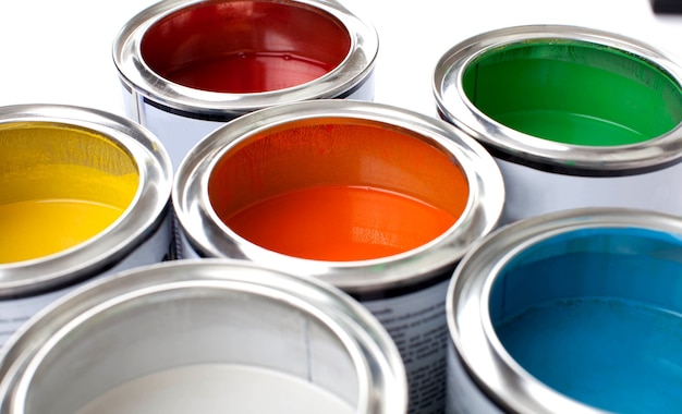 Multicolored Paint Cans on background