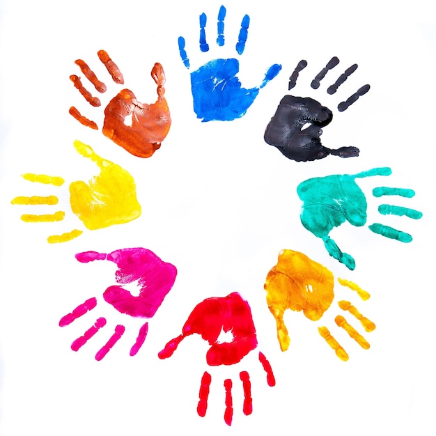 Multicolored painted hand prints on a white background