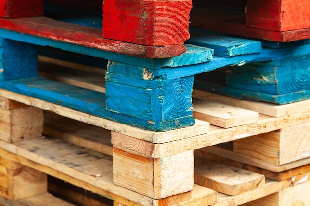 Multicolored pallets stacked on top of each other