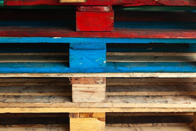 Multicolored pallets stacked on top of each other