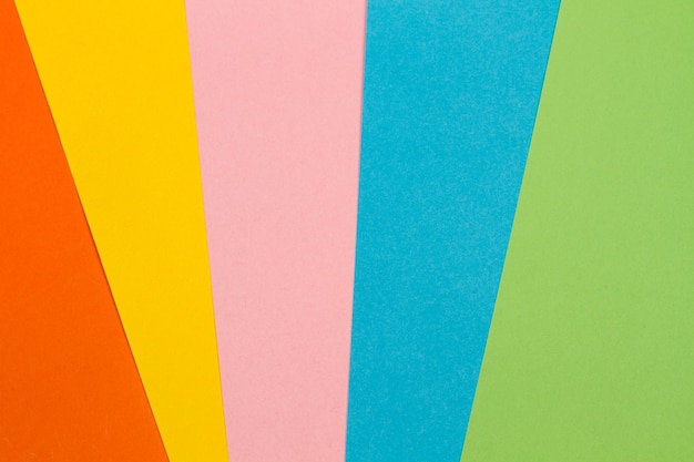 Multicolored paper background in a close up view