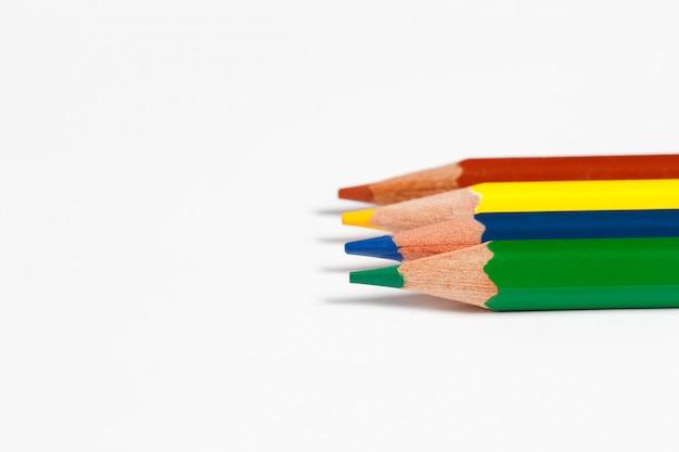Multicolored pencils for drawing on a white background