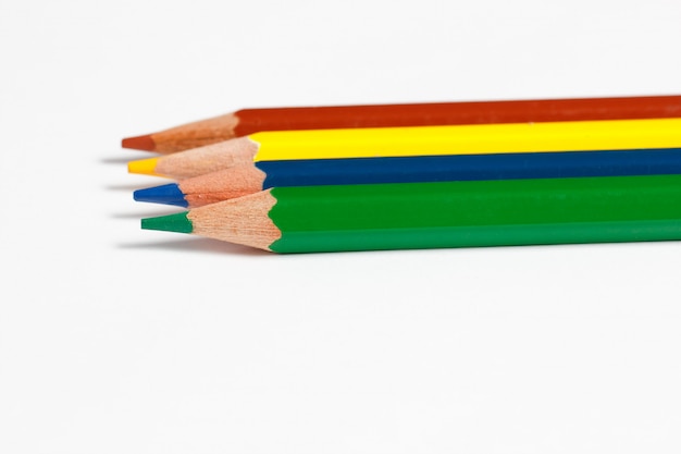 Photo multicolored pencils for drawing on a white surface