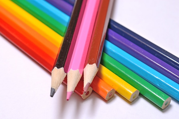 Multicolored pencils on a light background