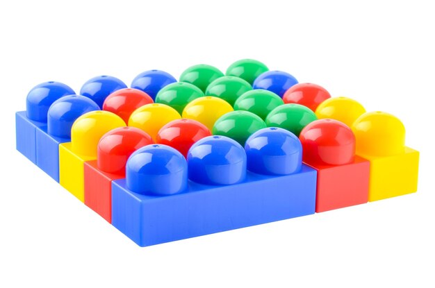 Photo multicolored plastic children's construction kit isolated on a white background design and modeling development of children's motor skills and thinking building different models