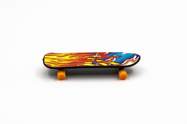 Multicolored plastic skateboard on a white background children's toy High quality photo