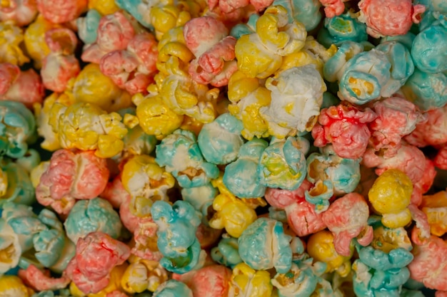 Multicolored popcorn closeup Colorful beautiful sweet dessert