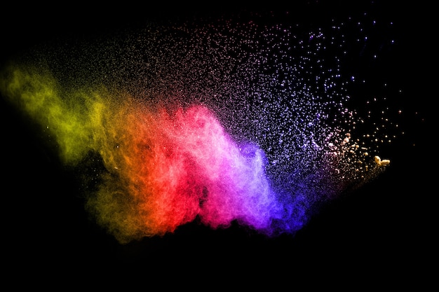 Multicolored powder explosion on black background.