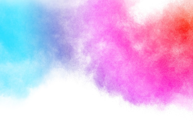 Multicolored powder explosion on white background.