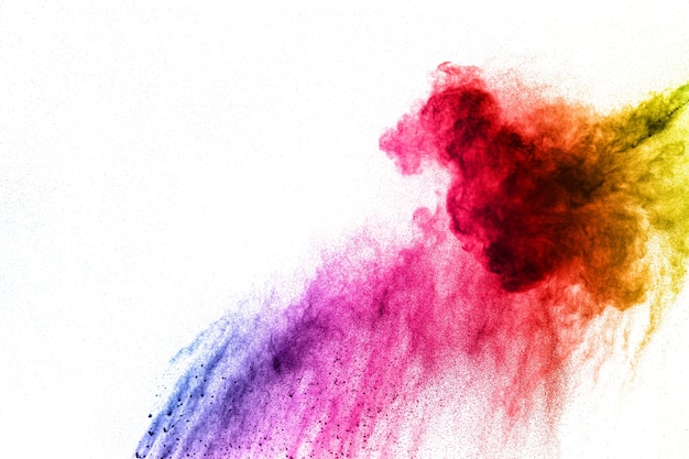 Multicolored powder explosion on white background.