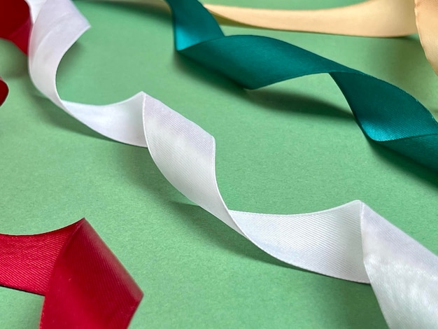 Multicolored ribbons on a green background