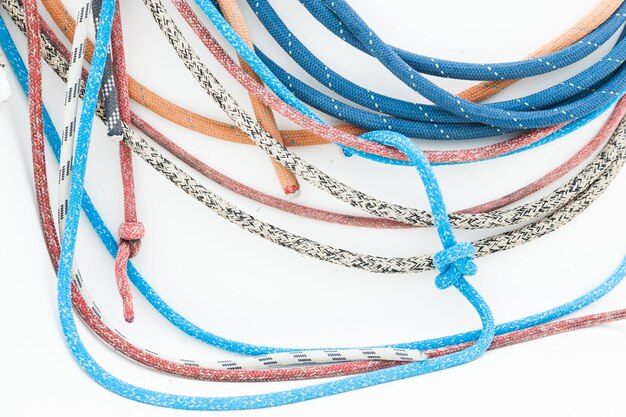 Multicolored ropes on a white background closeup