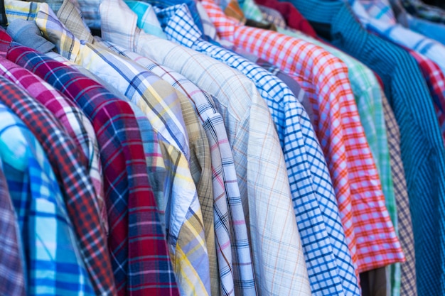 Multicolored shirts on hangers