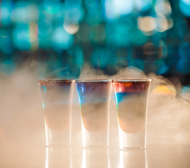 Multicolored shots on the bar