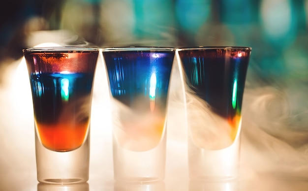 Photo multicolored shots on the bar