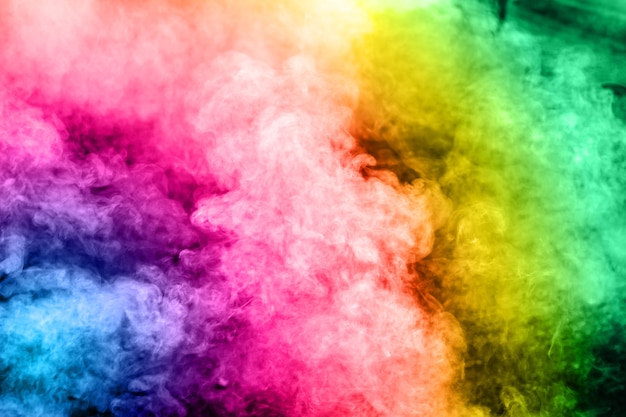 Multicolored smoke on background.