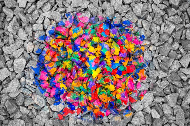 Multicolored stones in the middle of black and white stones