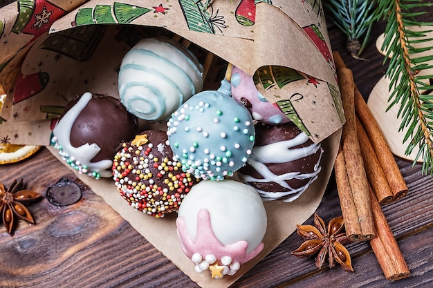 Multicolored sweet cake pops with christmas decorations