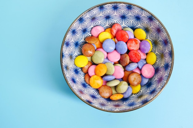 Multicolored sweet candies in a bowl close up