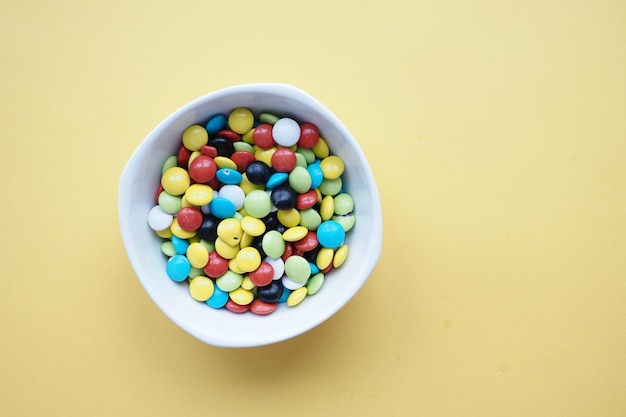 Multicolored sweet candies in a bowl close up