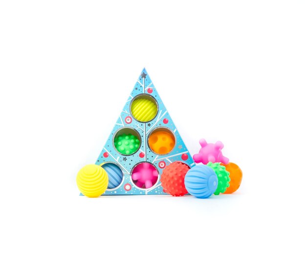 Multicolored textured balls for baby development. Children's educational toy on a white background.