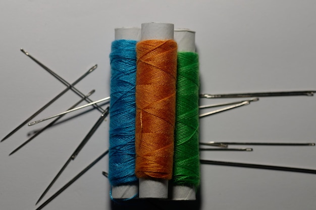 multicolored threads with needles