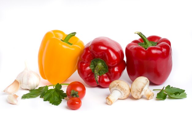Multicolored vegetables on a white background