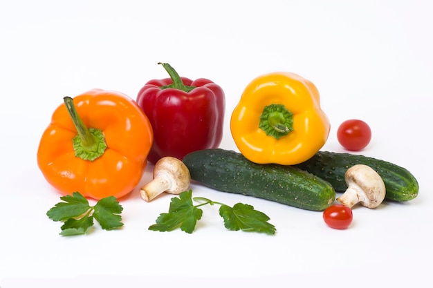 Multicolored vegetables on a white background