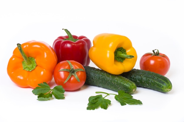 Multicolored vegetables on a white background