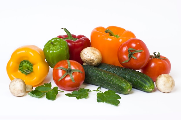 Multicolored vegetables on a white background