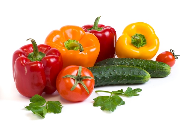 Multicolored vegetables on a white background