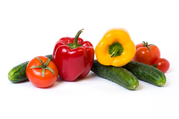 Multicolored vegetables on a white background