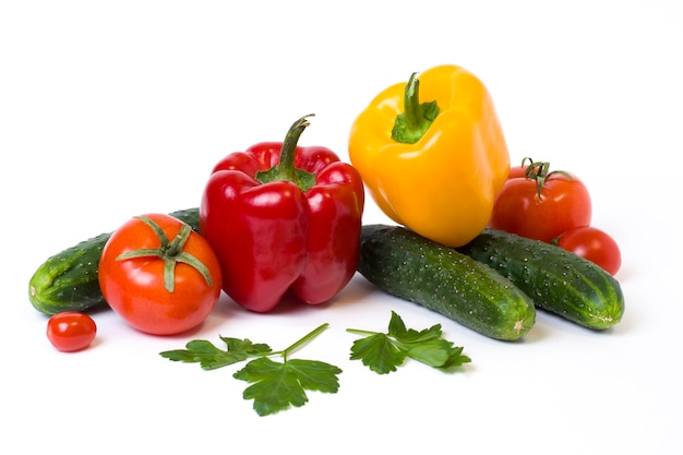 Multicolored vegetables on a white background