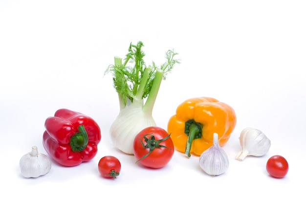 Multicolored vegetables on a white background