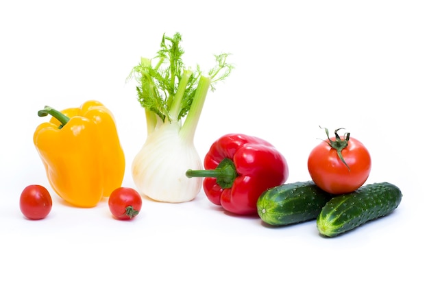 Multicolored vegetables on a white background