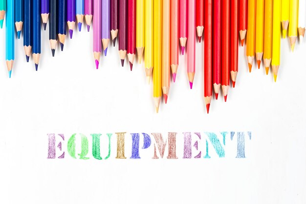 Multicolored wooden sticks Wooden colouring pencils and Equipment on white background