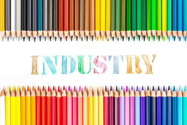 Multicolored wooden sticks Wooden colouring pencils and industry on white background