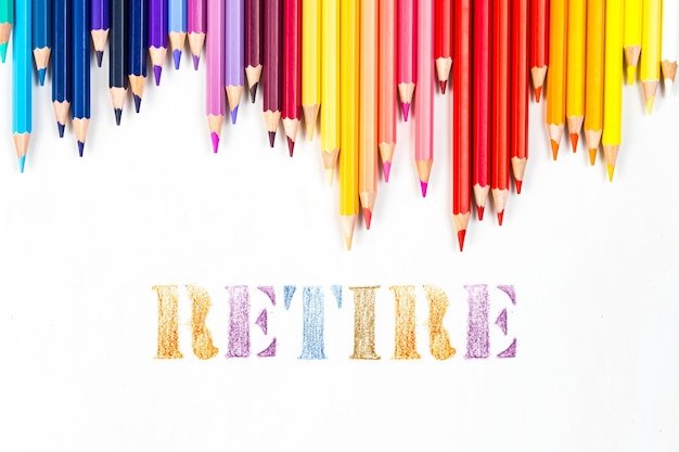 Photo multicolored wooden sticks wooden colouring pencils and retire on white background