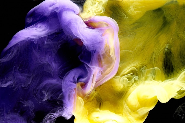 Multicolored yellow lilac smoke abstract background acrylic paint underwater explosion