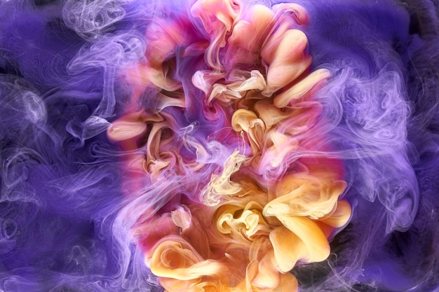 Multicolored yellow lilac smoke abstract background acrylic\
paint underwater explosion