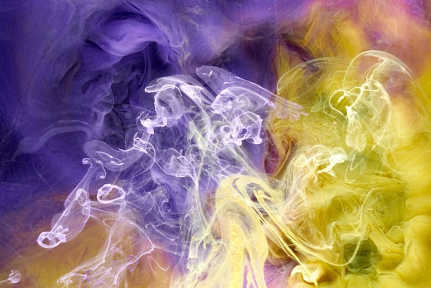 Multicolored yellow lilac smoke abstract background acrylic paint underwater explosion