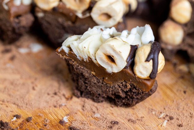 Multicomponent cake made of caramel and nuts in chocolate