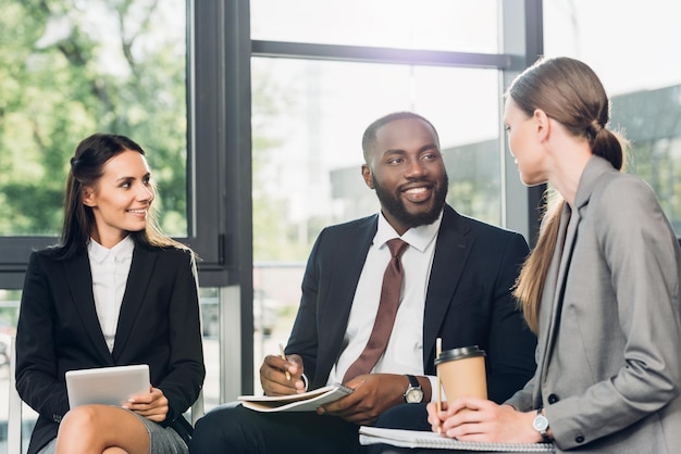 Multicultural business colleagues having meeting in conference hall