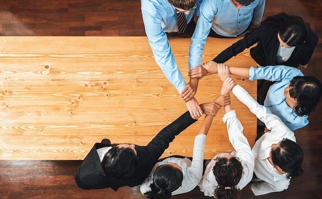 Photo multicultural business people holding hand together in circle meticulous