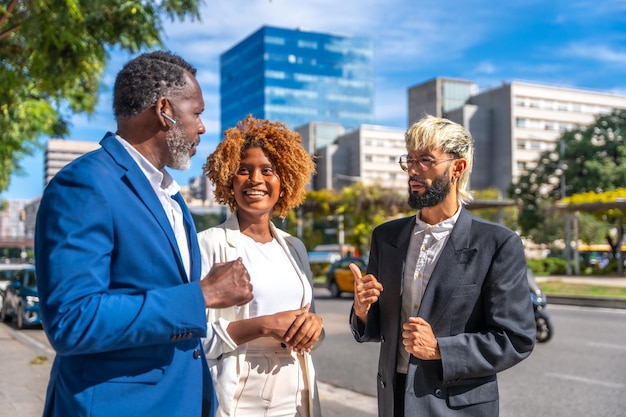 Multicultural business people talking on the city street