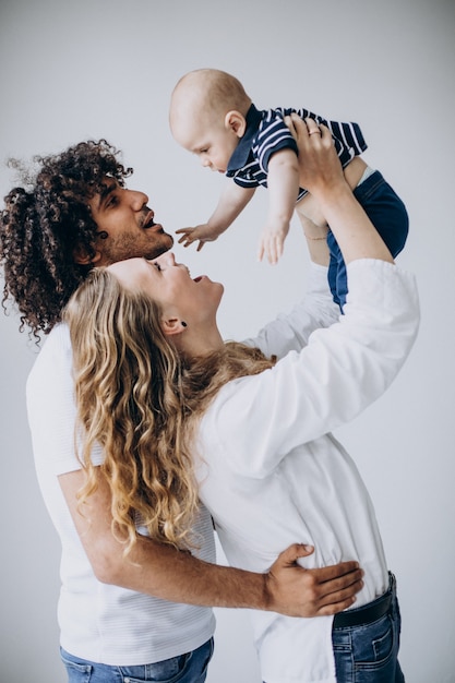 Multicultural family with their little son having fun together