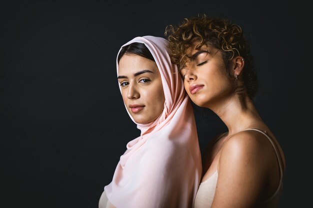 Multicultural group of beautiful women posing in underwear  